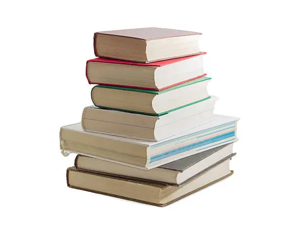 Photo of Stack of several different books on a light background