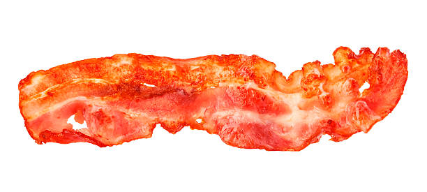 istock Cooked bacon strip close-up isolated on a white background. 515057074