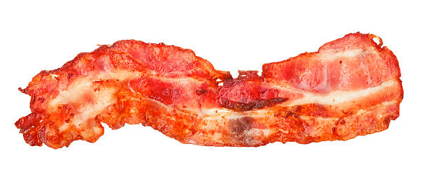 istock Cooked bacon strip close-up isolated on a white background. 515057108