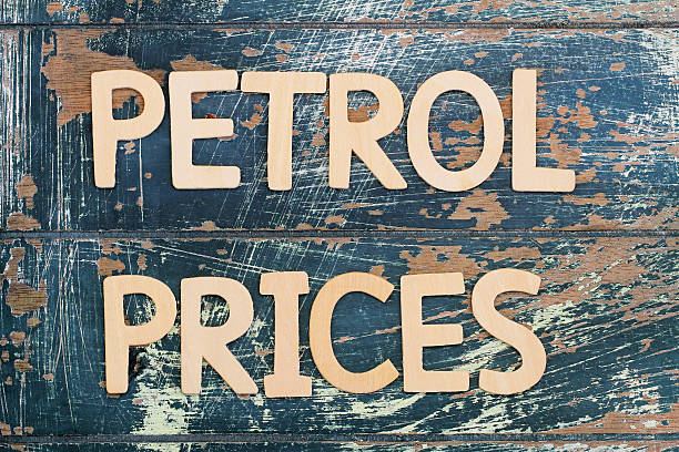 istock Petrol prices written with wooden letters on rustic surface 515058016