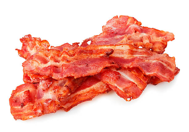 istock Cooked bacon rashers close-up isolated on a white background. 515058100