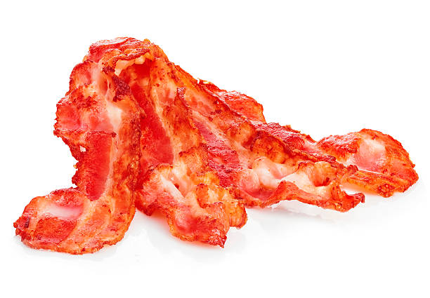 istock Cooked bacon rashers close-up isolated on a white background. 515058172
