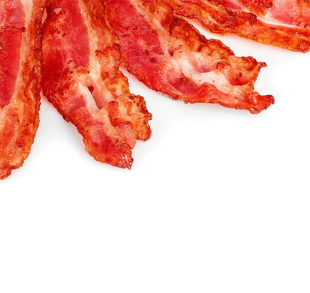 istock Cooked bacon rashers close-up isolated on a white background. 515058228