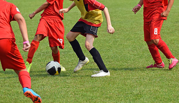 istock Kids are playing soccer 515058594