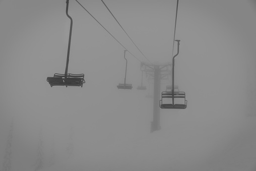 chairlift in the fog @ whitewater ski resort, canada