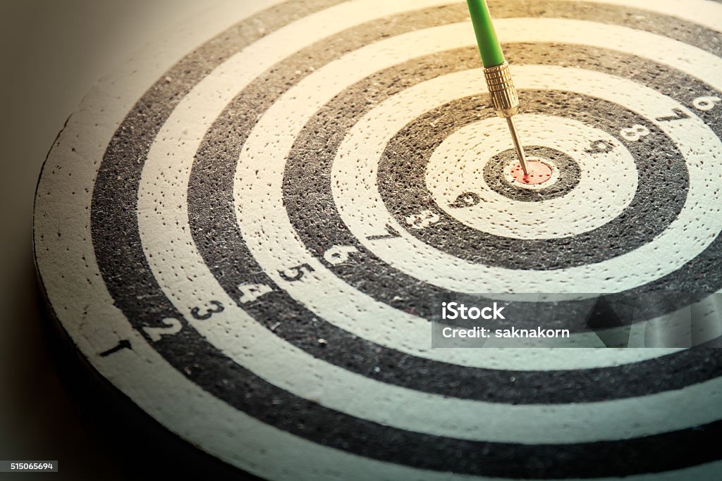dart arrow hitting in the target center of dartboard, dart arrow hitting in the target center of dartboard,abstract of success Accuracy Stock Photo