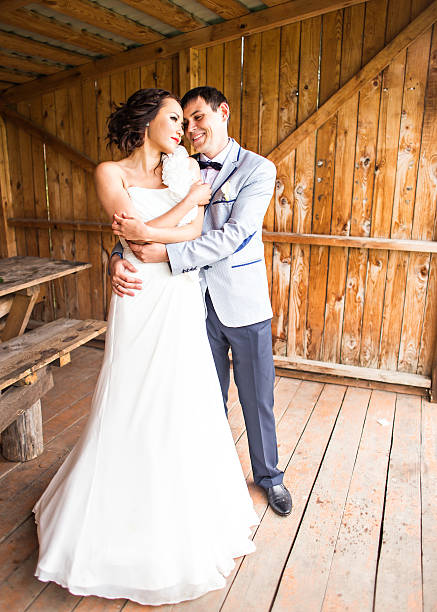 istock wedding pair hugging and kissing 515066132