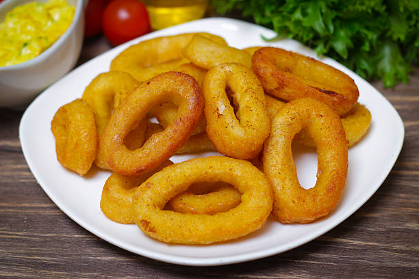 istock deep fried calamari with sauce and salad 515066320