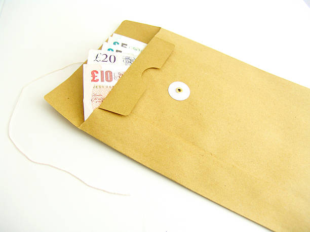 Brown envelope Brown envelope with money british currency photos stock pictures, royalty-free photos & images