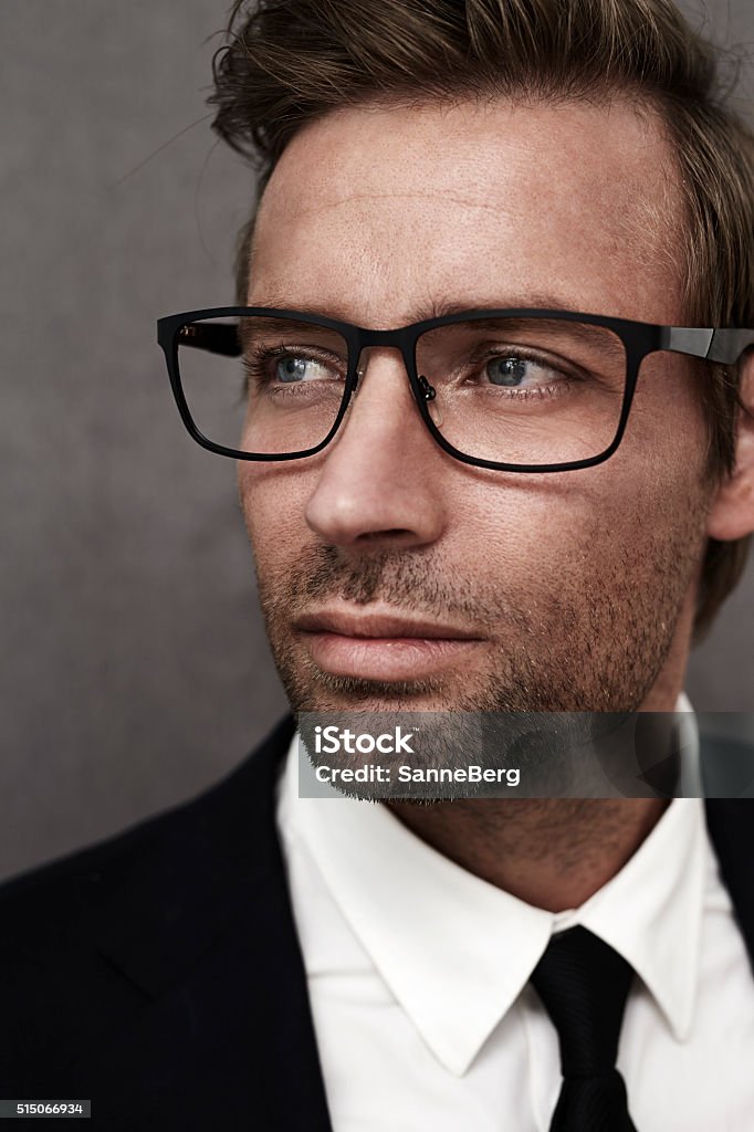 Man In Suit And Smart Spectacles Looking Away Stock Photo - Download Image  Now - 30-34 Years, Adult, Adults Only - iStock