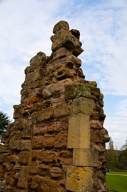 Rufford Abbey Old Stonework Rufford Abbey is a medieval monastery founded in 1147. Now open to the public and set in 150 acres of beautiful grounds, Rufford is a key tourist attraction in Nottinghamshire. It was once the home of aristocracy, but no-one now lives there. Here you see the remains of one of the walls, now a mere crumbling pillar of stonework. gargoyl stock pictures, royalty-free photos & images