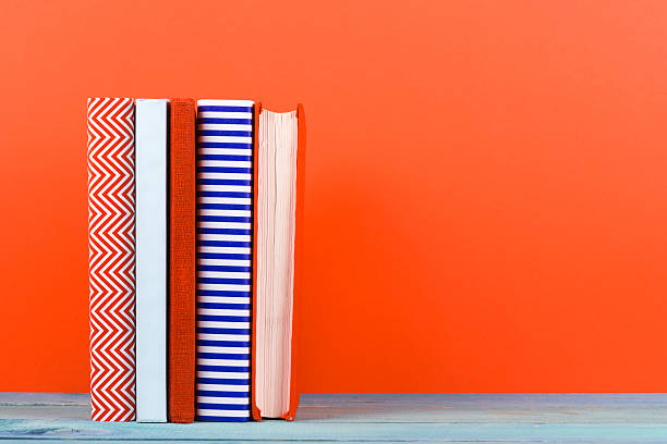 istock Composition with vintage old hardback books, diary, fanned pages 515067410