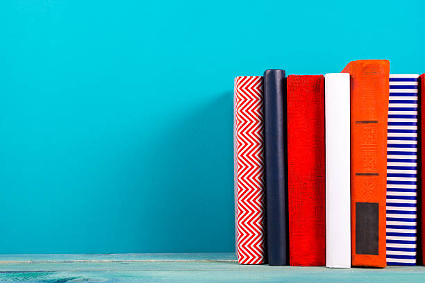 istock Stack of colorful books, grungy blue background, free copy space 515067642