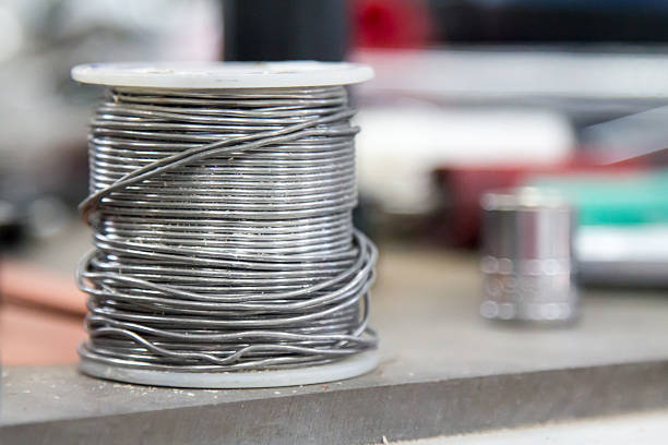 Metal wire spool in a shop, focus on the wire