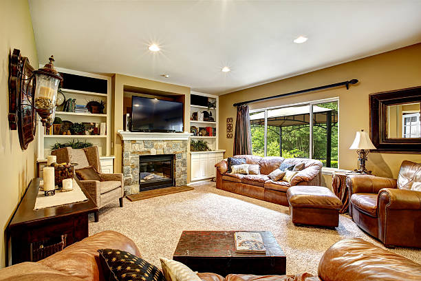 istock Living room with leather couch and fireplace 515068631