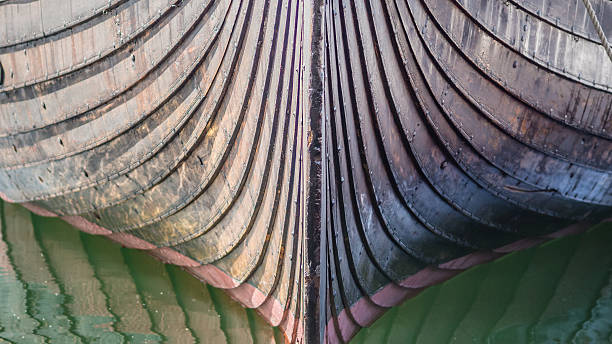 Texture of old wooden surface. Side of the hull of an old wooden ship.