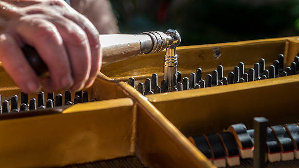 Tuning with grand piano stock photo