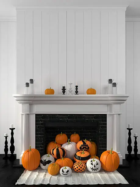 Photo of White fireplace decorated with pumpkins for Halloween