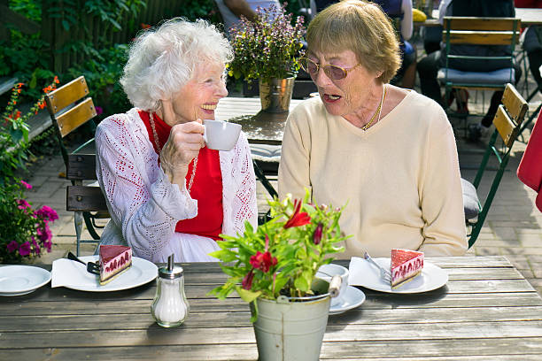 istock Two elderly female friends relaxing over tea. 515070616