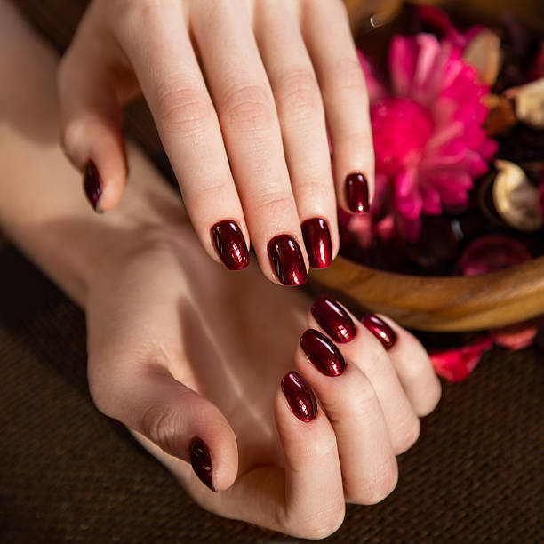 istock Beautiful classic red manicure on female hand. Close-up 515070864
