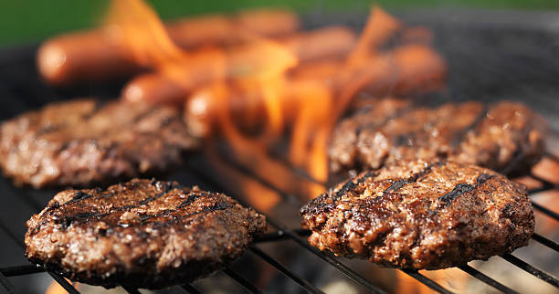 istock hamuburgers and hotdogs cooking panorama 515071875
