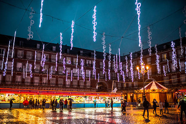 People buying gifts at Christmas Market, Madrid stock photo