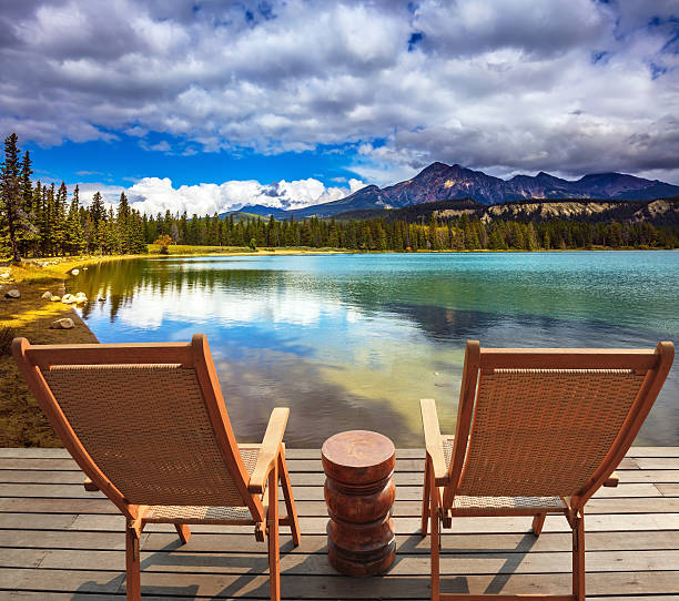 istock Two lounge chairs on the lake 515073482