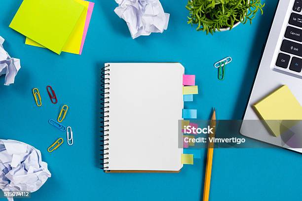 Office Table Desk With Set Of Colorful Supplies White Blank Stock Photo - Download Image Now