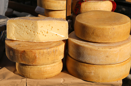 tasty mature cheese with holes for sale in the market of food