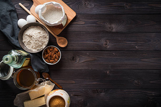 istock Ingredients for baking on a wooden background top view 515074754