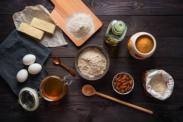 istock Ingredients for baking on a wooden background top view 515074864