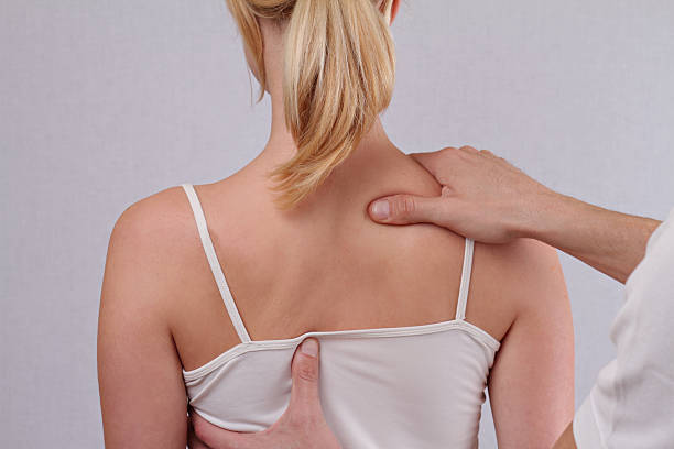 istock Dorsal manipulation therapist  doing healing treatment on woman back 515075514