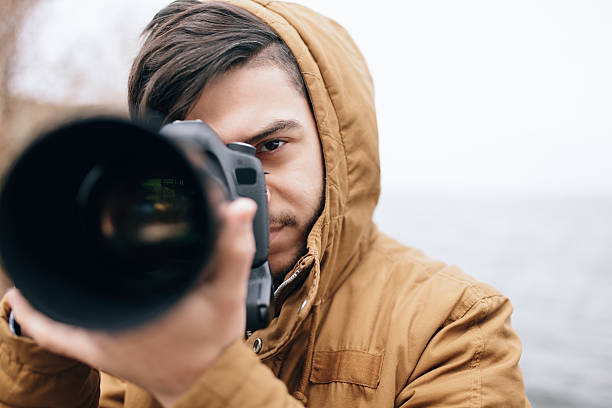 istock Photographer take picture in open space at river 515076284