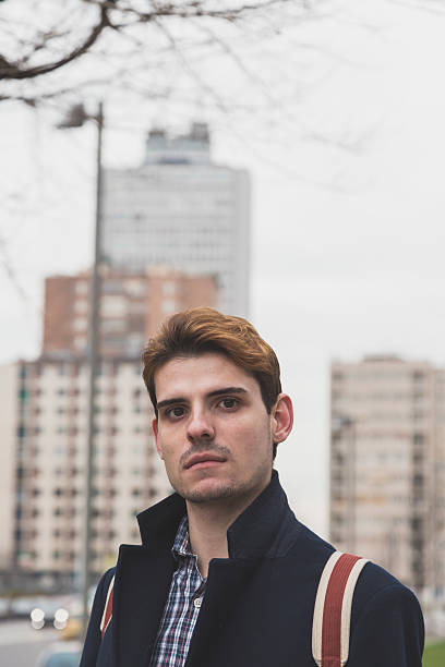 istock Young man posing in the city streets 515077390