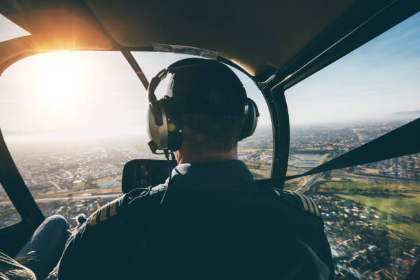 istock Male pilot flying a helicopter 515077524