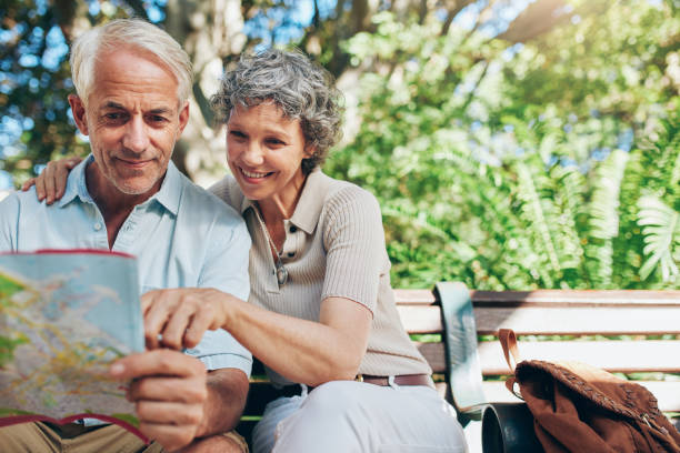 istock Happy senior tourist  reading map 515080008