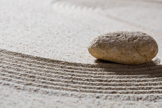 istock pebble on sinuous waves for concept of wellbeing or spa 515080496