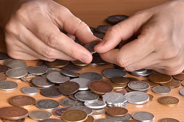 istock hands with heap of coins, closeup 515080678