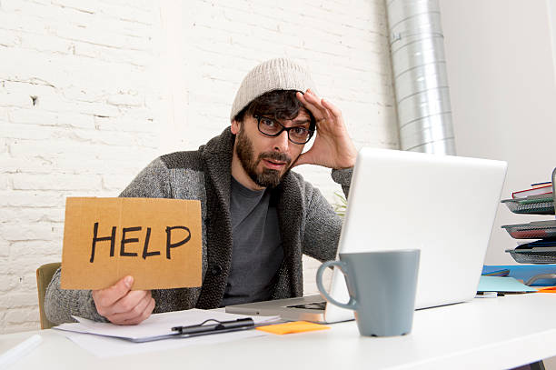 istock tired hispanic hipster businessman asking for help suffering work stress 515082576