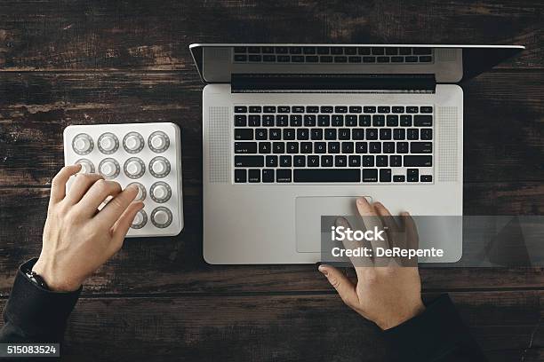 Two Hands Working On Mixer And Laptop Top View Stock Photo - Download Image Now - Balance, Broadcasting, Business Finance and Industry