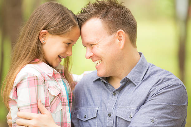 istock Father, daughter hugging outdoors. Parent, child. Love, affection. 515084636
