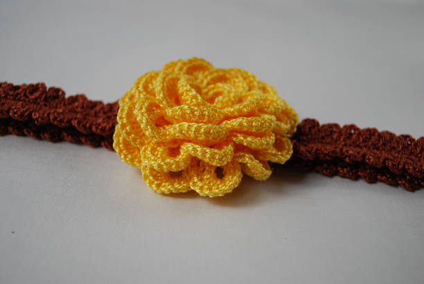 istock Headband brown with yellow flower. 515085408