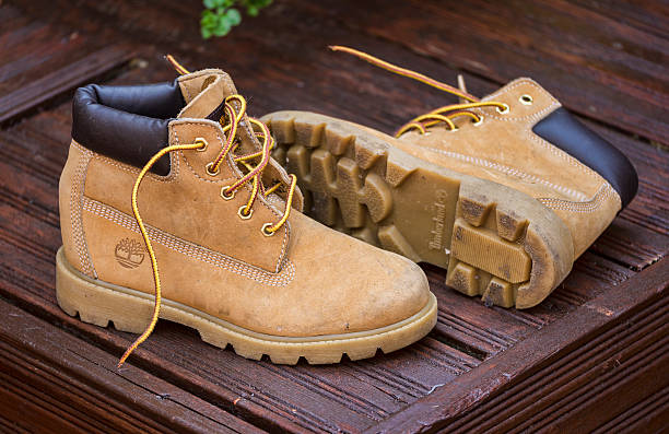 navegación Flojamente hostilidad Pair Of Worn Timberland Boots Stock Photo - Download Image Now - Boot, The  Timberland Company, Construction Worker - iStock