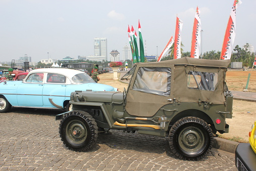 Jakarta, Indonesia - October 8, 2012: Vintage cars go on display at the exhibition of arms and military vehicles that organized by the Indonesian National Army in the field of the National Monument in Central Jakarta, Indonesia, to commemorate Armed Forces Day 67th.