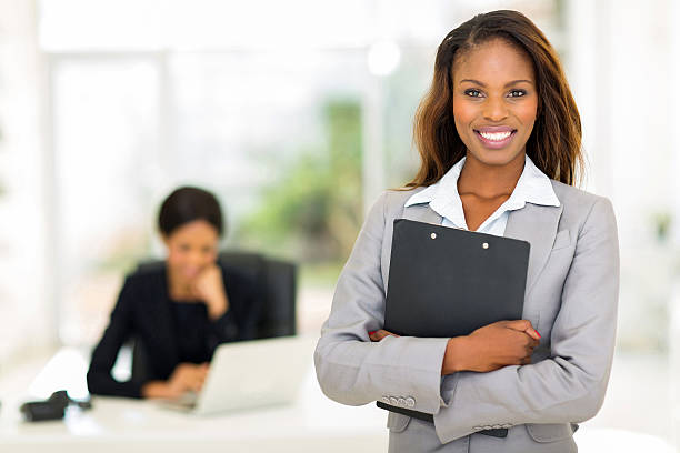 istock black business woman holding clipboard 515143429