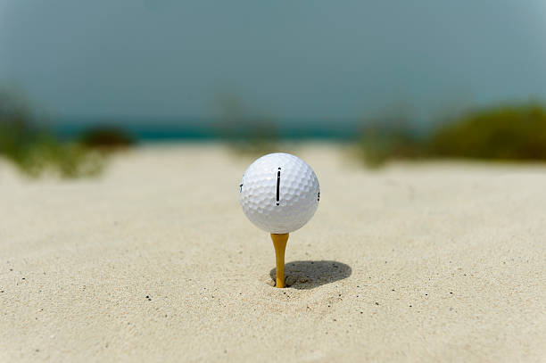 istock golfball up a tee the sand 515144229