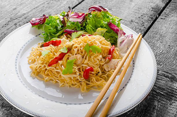 istock Chinese noodles with chicken and fresh salad 515144613