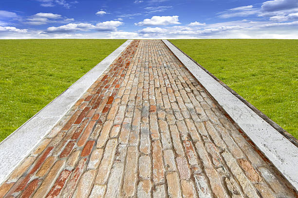 old brick road - brick yellow road footpath стоковые фото и изображения