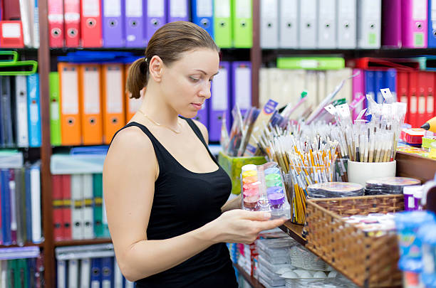 istock woman buys paint 515146389