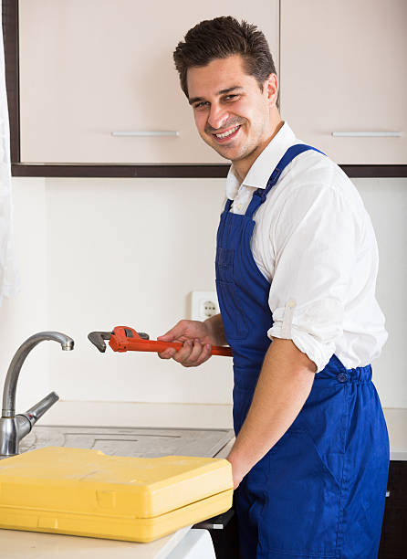 istock Professional plumber with tools near sink indoors 515147154